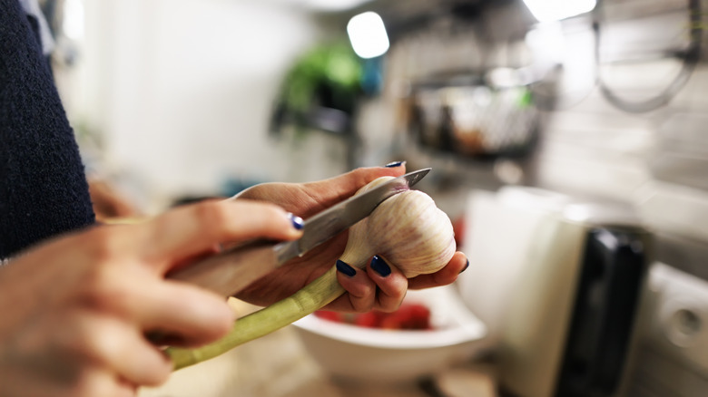 Woman peeling garlic