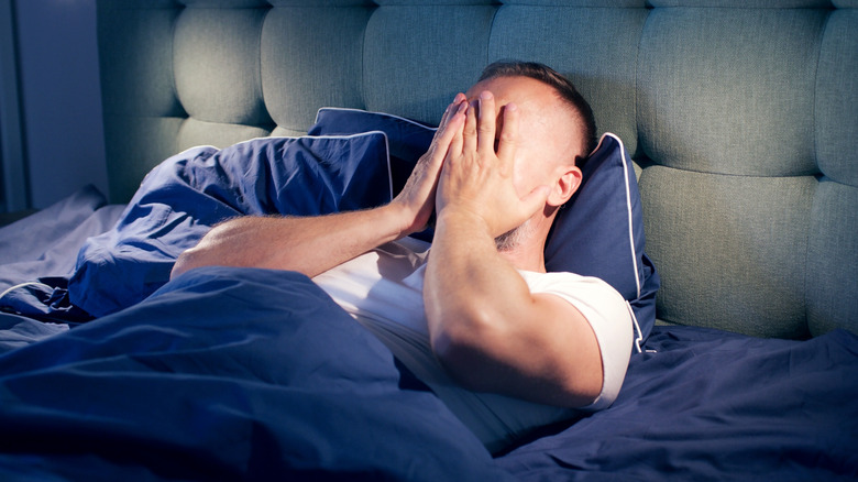 man awake at night unable to sleep