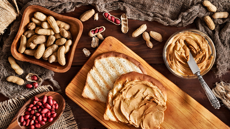 Peanuts in bowls, peanut butter sandwhich