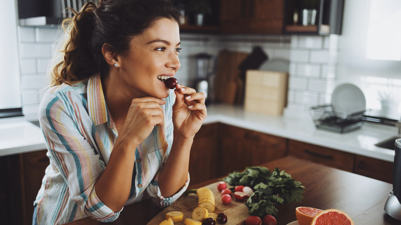 Woman eating fruit