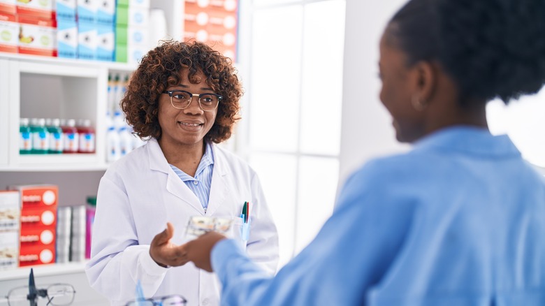 Customer paying at pharmacy