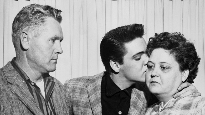 Elvis with his parents, Vernon and Gladys