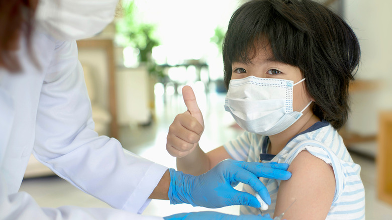 young child getting vaccine