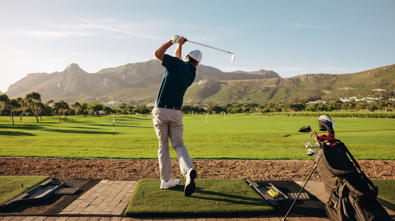 man golfing