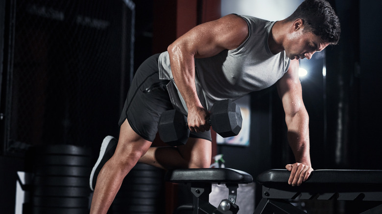 man working out with dumbell