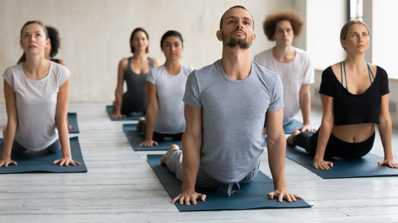 yoga students taking class