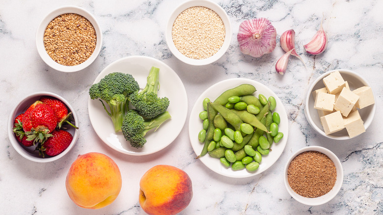 raw fruits, veggies, seeds in bowls