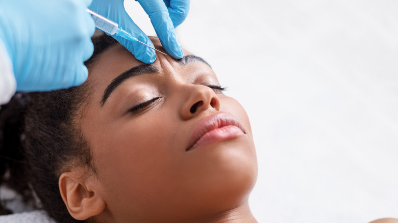 A woman gets a Botox injection