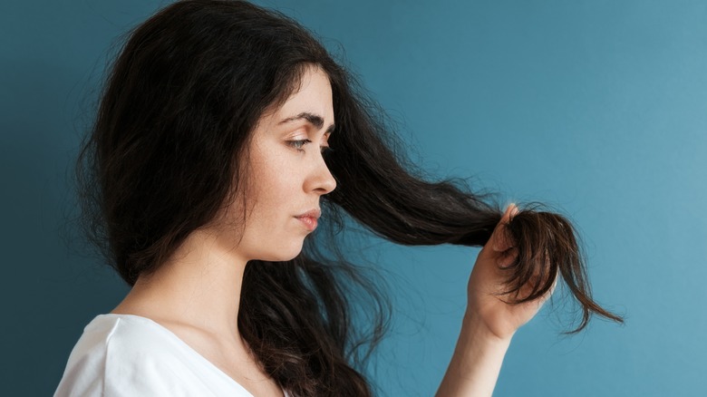 woman pulling hair