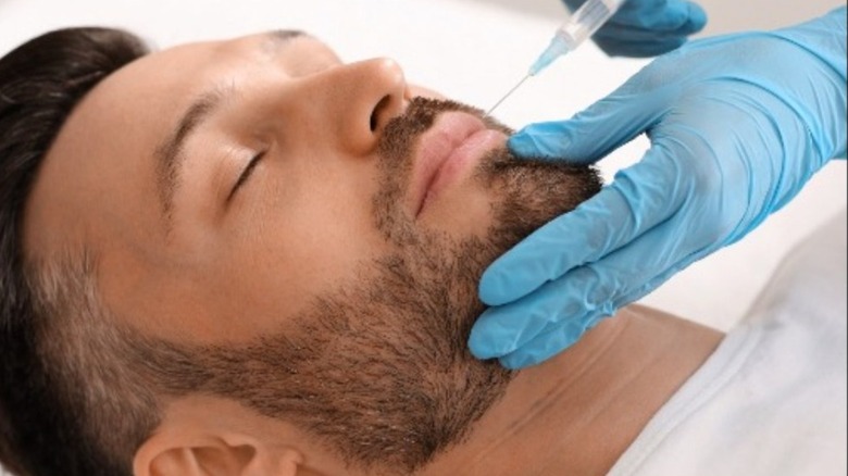 man getting facial fillers