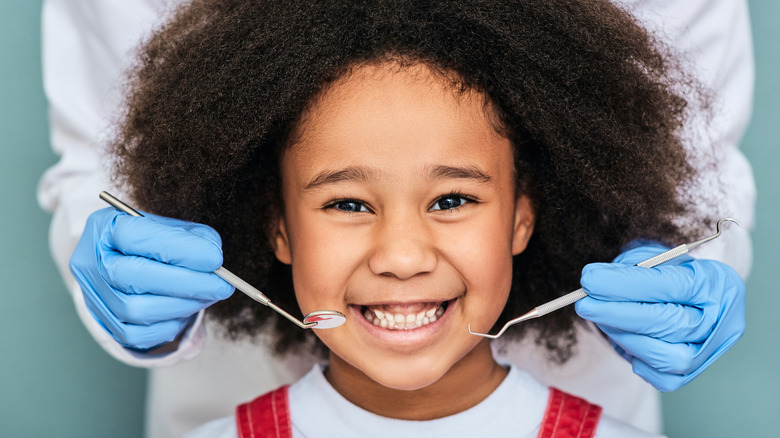 Child's being checked for cavities