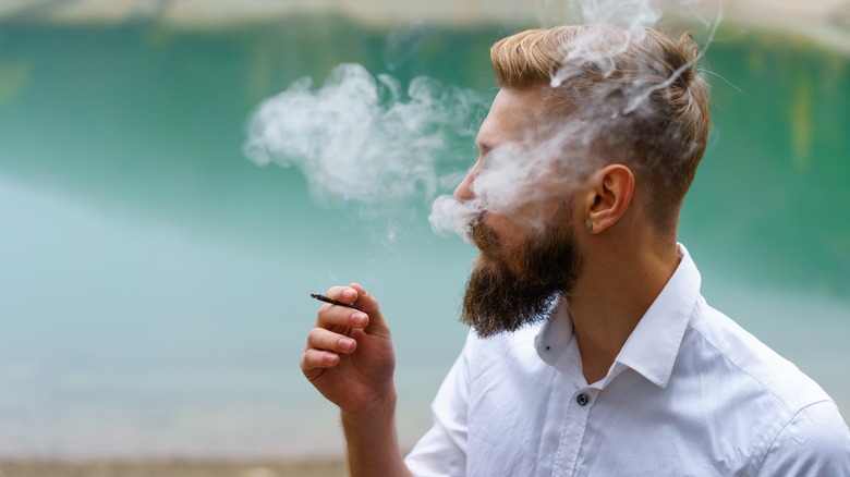 man smoking cigarette