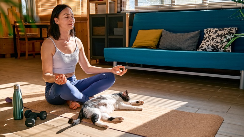 woman meditating floor