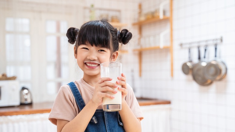 Young child drinking milk