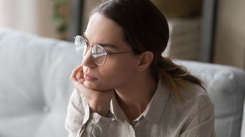 Woman staring off in thought