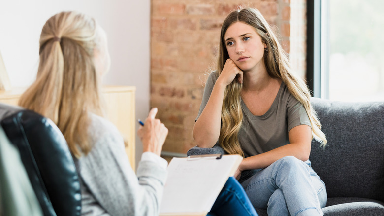 woman listening to her therapist