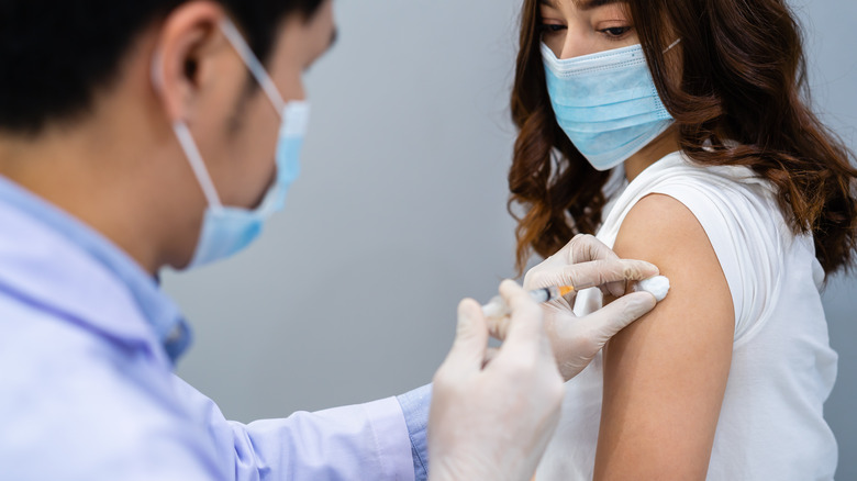 Woman getting COVID-19 vaccine