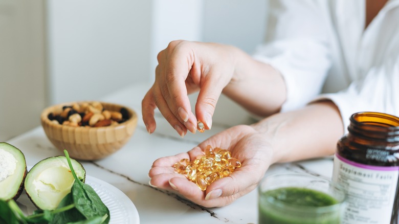 Hand holding supplements