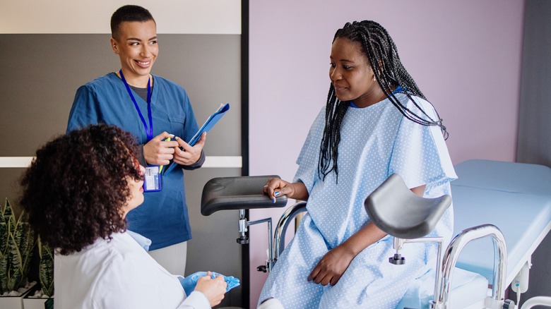 Woman speaking to gynecologist