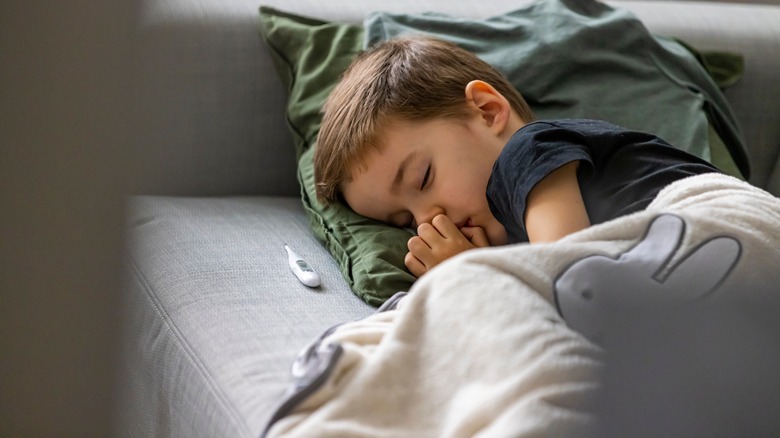 young boy at home sick