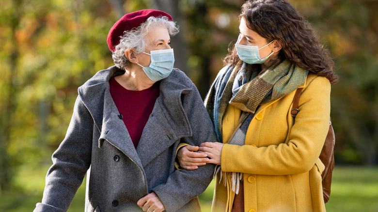 mother and daughter wearing masks