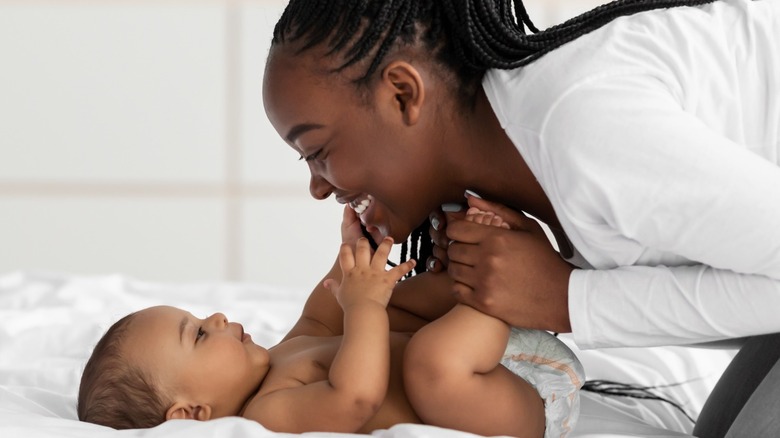 mom smiling at baby