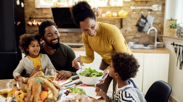 A happy family sitting together around the table