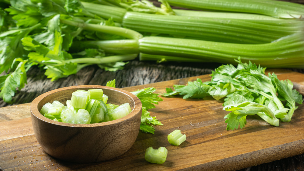 chopped celery on a cutting board