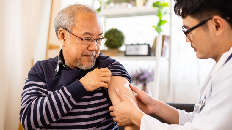 older man getting vaccinated