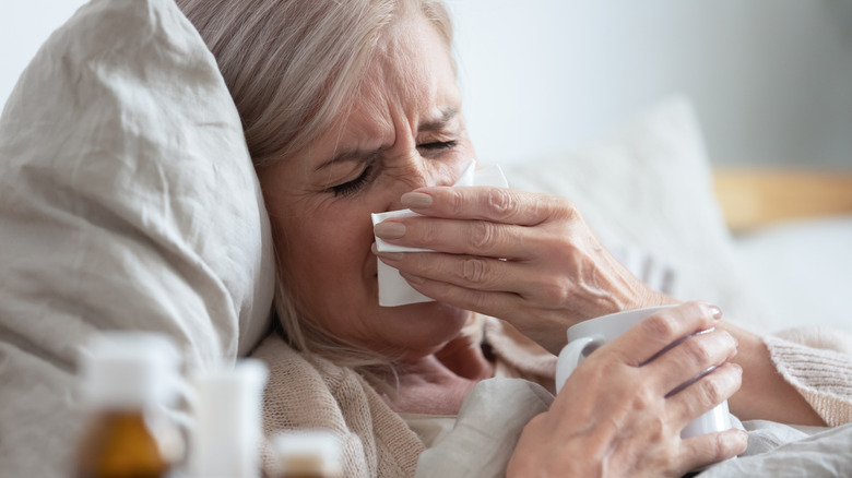 older adult sick in bed