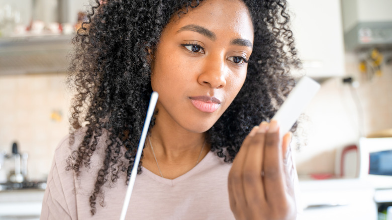 woman using a COVID test kit