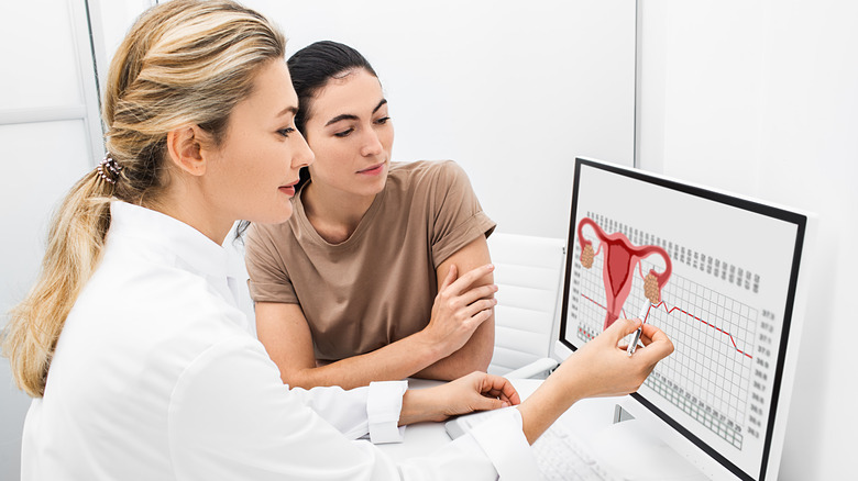 Doctor reviewing menstrual cycle data with a patient