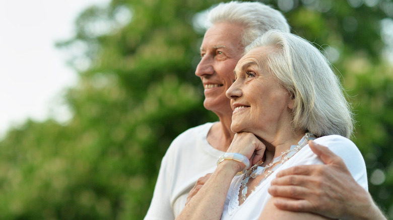 smiling elderly couple