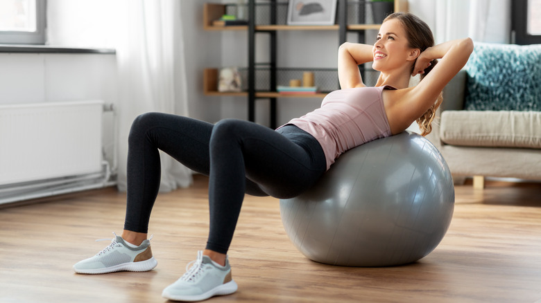Woman exercising on stability ball
