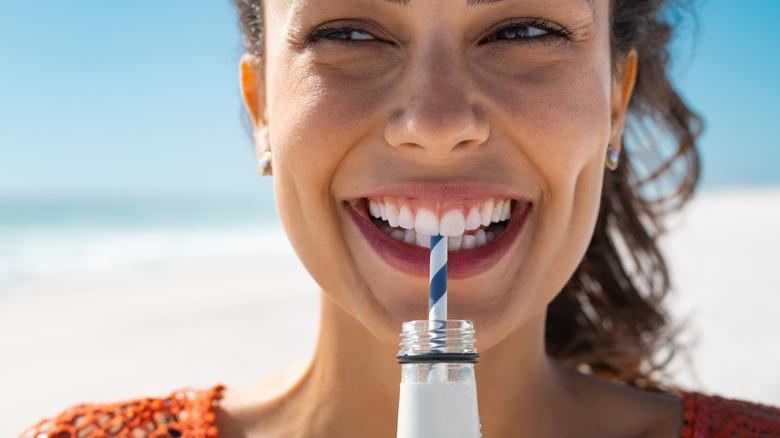 woman drinking sparkling water