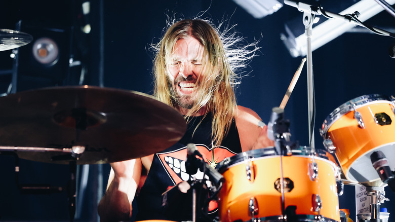 Taylor Hawkins playing orange drum set
