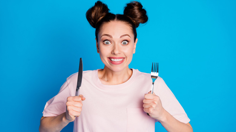 woman with knife and fork