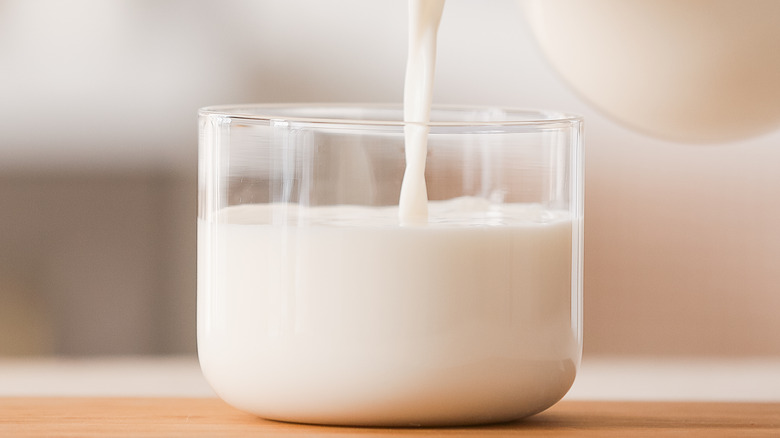 milk being poured into glass