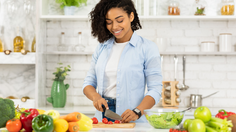 woman making salad