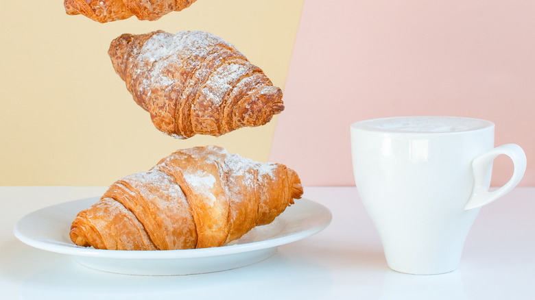 croissants on plate with hot drink