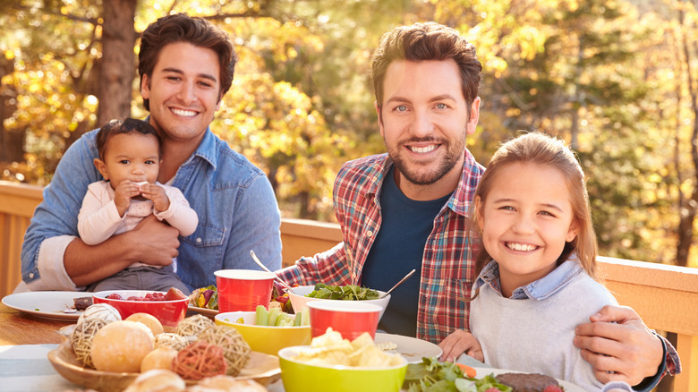 a family eating a meal together 