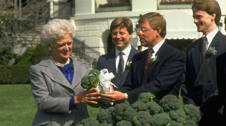 Barbara Bush being presented 10 tons of broccoli