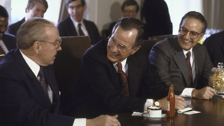 George H.W. Bush being presented with pork rinds and tabasco sauce