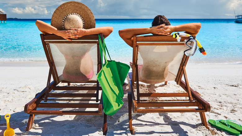 Couple lounging on the beach