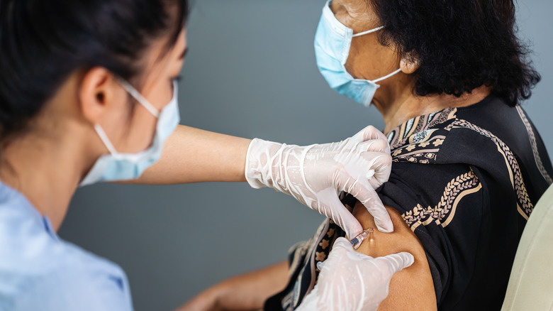 Woman receiving vaccine