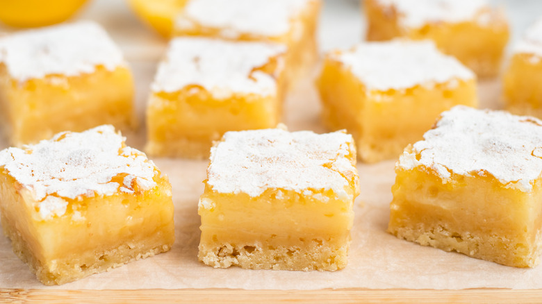lemon bars on wooden surface