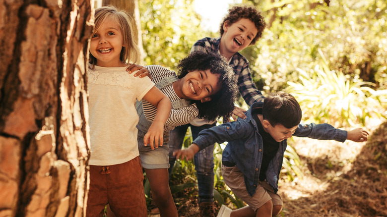 Kids smiling in woods