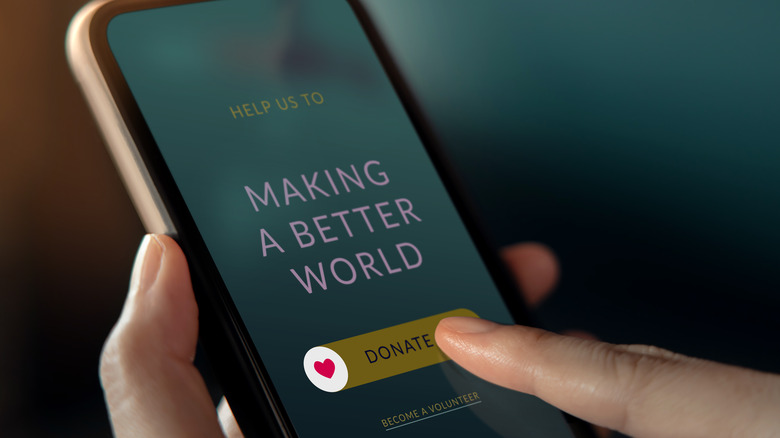 A phone with the words Making a Better World on the screen