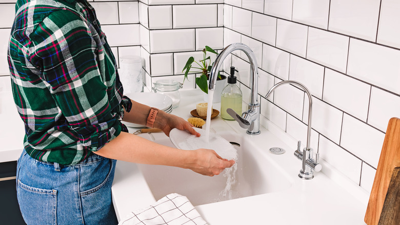 Woman washing dishes