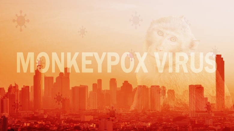 a cityscape covered with the words 'monkeypox virus'